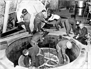 British and American members of the Alsos Mission dismantle the experimental nuclear reactor that German scientists had built as part of the German nuclear energy project in Haigerloch