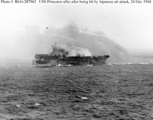USS Princeton (CVL-23) burning, but still underway, about twenty minutes after she was hit by a Japanese air attack, 24 October 1944. Photographed from USS South Dakota (BB-57). Official U.S. Navy Photograph, National Archives.