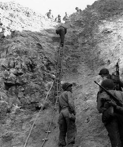 Normandy Invasion, June 1944 U.S. Army Rangers show off the ladders they used to storm the cliffs at Pointe du Hoc, which they assaulted in support of "Omaha" Beach landings on "D-Day".