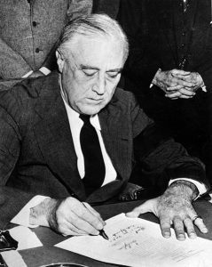 United States President Franklin D. Roosevelt signing the declaration of war against Japan, in the wake of the attack on Pearl Harbor. Date8 December 1941