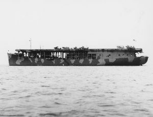 The U.S. Navy escort carrier USS Long Island (ACV-1), photographed in Measure 12 (Modified) camouflage, 11 November 1941. Planes on her flight deck include seven Curtiss SOC-3A scout observation types and one Brewster F2A fighter. November 11th, 1941.