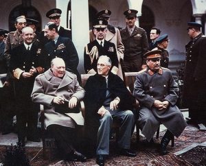 English: Yalta summit in February 1945 with (from left to right) Winston Churchill, Franklin Roosevelt and Joseph Stalin. Also present are USSR Foreign Minister Vyacheslav Molotov (far left); Field Marshal Alan Brooke, Admiral of the Fleet Sir Andrew Cunningham, RN, Marshal of the RAF Sir Charles Portal, RAF, (standing behind Churchill); George Marshall, Army Chief of Staff and Fleet Admiral William D. Leahy, USN, (standing behind Roosevelt). Date February 1945 Source [1] The source web page include the following caption: Photo #: USA C-543 (Color)
