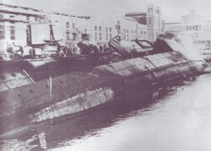 The "Town" class destroyer HMS Cameron (ex-USS Welles, DD-257) after being blown off the blocks during an air raid whilst in dock at Portsmouth and burnt out on 5 December 1940.