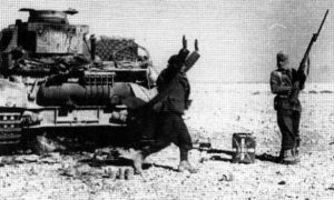An Italian soldier surrenders to an Indian Jawan during the successful allied campaign of Operation Crusader.
