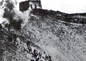 Japanese forces charging toward the wall defense.