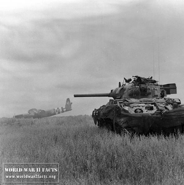  A Sherman tank of 13th/18th Royal Hussars in action against <a href=
